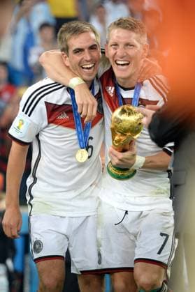 Bastian SCHWEINSTEIGER ends his career Archivfoto v li Philipp LAHM GER ,Bastian SCHWEINSTEIGER GER ,Jubel,Joy,Enthusiasm,,Action,Award ceremony,Cup,Trophy,Trophy,Cup Germany GER Argentina ARG 1 0 n V Final,Final,Game 64, on 13 07 2014 in Rio de Janeiro Football World Cup 2014 in Brazil from 12 06 13 07 2014 Â