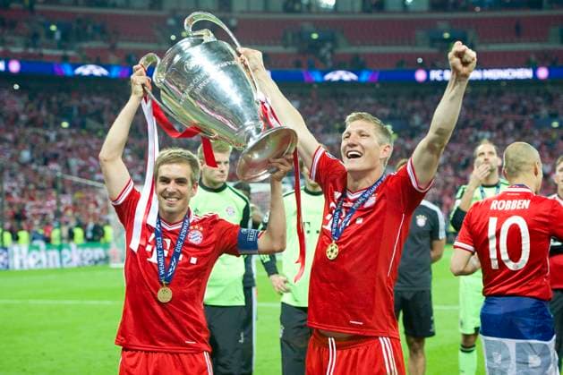 Bastian SCHWEINSTEIGER ends his career Archivfoto Philipp LAHM li and Bastian SCHWEINSTEIGER both M cheer with trophy, Football Champions League Final 2013 Borussia Dortmund DO FC Bayern Muenchen M 1 2 Season2012 13, WEMBLEY Stadium, 25 05 2013 Â