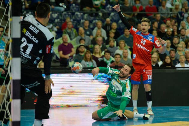LIQUI MOLY Handball Bundesliga 2019 2020, 9 matchday, SC DHfK Leipzig vs HBW Balingen Weilstetten 10 10 2019 Goalscoring Lukas Binder Outside player DHfK Leipzig, back number 11 middle right against Vladimir Bozic Tormann Balingen Weilstetten, back number 21 left and Oddur Gretarsson Outside player Balingen Weilstetten, back number 14 right in Handball Bundesliga Spiel Leipzig vs Balingen Weilstetten Leipzig Saxony Germany Arena Leipzig