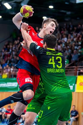 Würzburg, Germany 11 October 2019 2 BL 19 20 DjK Rimpar Wolves vs SG BBM Bietigheim v left in the duel Nikola Vlahovic Bietigheim , Benedikt Brielmeier Rimpar Würzburg s Oliver Arena Germany