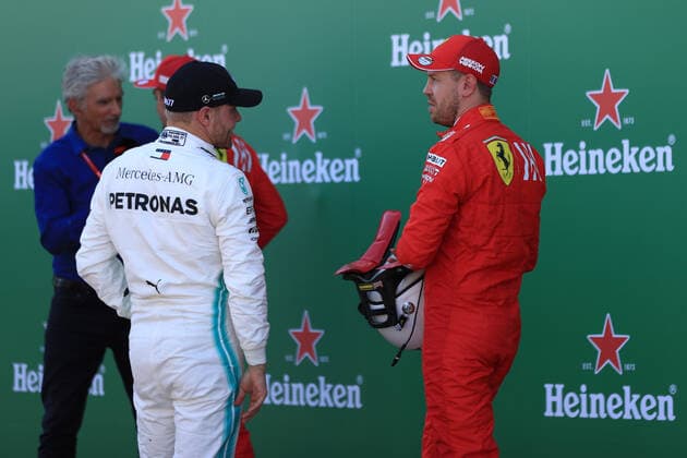 13th October 2019; Suzuka Circuit, Suzuka City, Japan; Formula One Japanese Grand Prix, Qualifying; Scuderia Ferrari, Sebastian Vettel takes pole and talks with Mercedes AMG Petronas Motorsport, Valtteri Bottas - Editorial Use  ActionPlus12176760 LeannexBoon