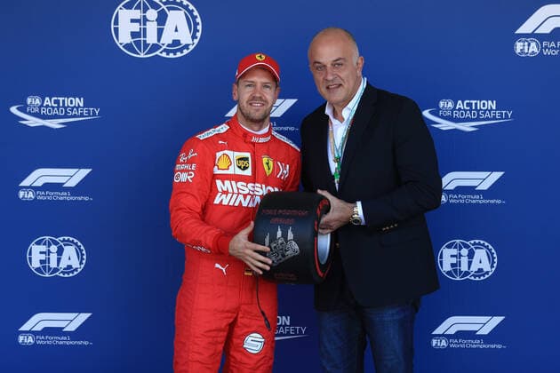 13th October 2019; Suzuka Circuit, Suzuka City, Japan; Formula One Japanese Grand Prix, Qualifying; Scuderia Ferrari, Sebastian Vettel receives the Pirelli Pole Position Award from the Pirelli Representative, Dimitrios Papadakos, Pirelli CCO North East Asia - Editorial Use  ActionPlus12176766 LeannexBoon