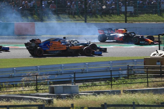 13th October 2019; Suzuka Circuit, Suzuka City, Japan; Formula One Japanese Grand Prix, Race Day; Aston Martin Red Bull Racing, Max Verstappen slides across the grass after contact with Leclerc- Editorial Use  ActionPlus12176830 LeannexBoon