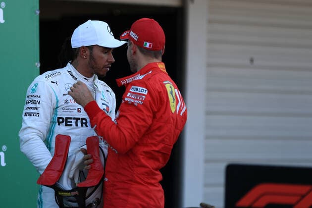 13th October 2019; Suzuka Circuit, Suzuka City, Japan; Formula One Japanese Grand Prix, Race Day; Scuderia Ferrari, Sebastian Vettel talks with Mercedes AMG Petronas Motorsport, Lewis Hamilton - Editorial Use  ActionPlus12176852 LeannexBoon
