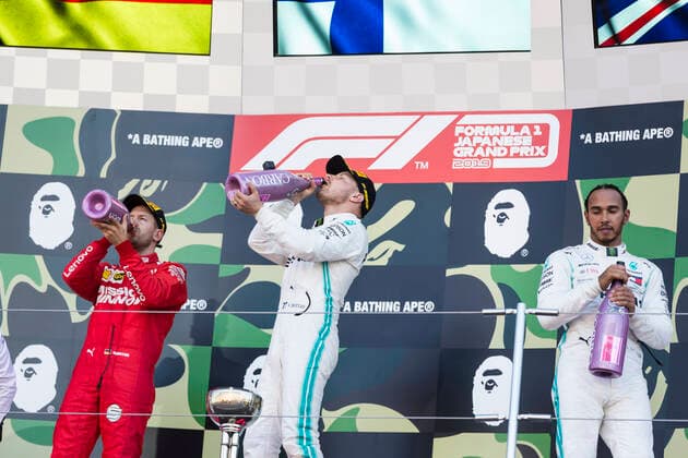 13th October 2019; Suzuka Circuit, Suzuka City, Japan; Formula One Japanese Grand Prix, Race Day; Sebastian Vettel, Valtteri Bottas, Lewis Hamilton celebrates on the podium after the race - Editorial Use  ActionPlus12176877 StephenxBlackberry