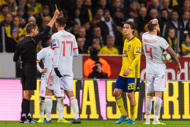 191015 Fabian Ruiz of Spain and Kristoffer Olsson of Sweden receive a yellow card from referee Clement Turpin during the UEFA Euro Qualifier football match between Sweden and Spain on October 15, 2019 in Stockholm,  Copyright: SIMONxHASTEGARD BB191015SH022