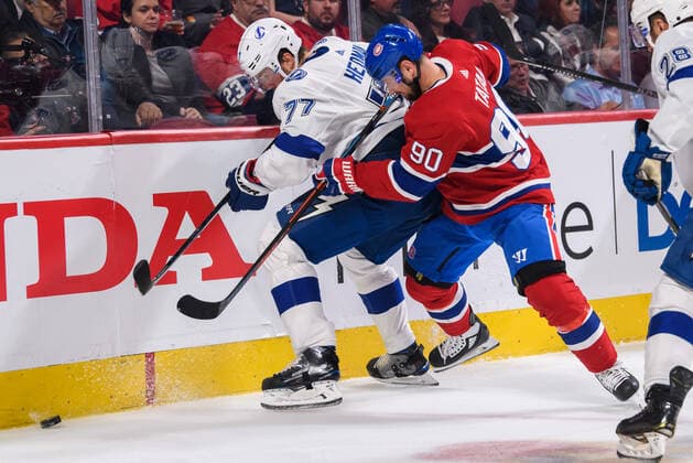 MONTREAL, QC - OCTOBER 15: Tomas Tatar (90) of the Montreal Canadiens and Victor Hedman (77) of the Tampa Bay Lightning battle for the puck during the second period of the NHL, Eishockey Herren, USA game between the Tampa Bay Lighting and the Montreal Canadiens on October 15, 2019, at the Bell Centre in Montreal, QC(Photo by Vincent Ethier Icon Sportswire) NHL: OCT 15 Lightning at Canadiens Icon1910151459