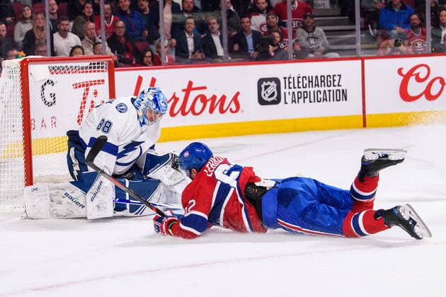 MONTREAL, QC - OCTOBER 15: Artturi Lehkonen (62) of the Montreal Canadiens falls on the ice while trying to deviate the puck toward Andrei Vasilevskiy (88) of the Tampa Bay Lightning during the second period of the NHL, Eishockey Herren, USA game between the Tampa Bay Lighting and the Montreal Canadiens on October 15, 2019, at the Bell Centre in Montreal, QC(Photo by Vincent Ethier Icon Sportswire) NHL: OCT 15 Lightning at Canadiens Icon1910152220