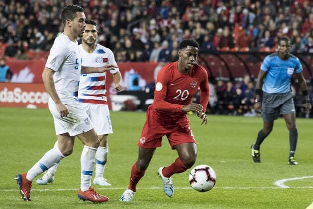 October 15, 2019, Toronto, Ontario, Canada: Daniel Lovitz (5), Critian Roldan (15) and Jonathan David (20) in action during the Canada vs USA - Nations League qualifier game Canada vs USA - Nations League qualifier - ZUMAm154 20191015_zap_m154_014 Copyright: xAngelxMarchinix