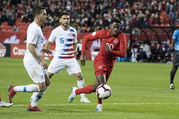 October 15, 2019, Toronto, Ontario, Canada: Daniel Lovitz (5), Critian Roldan (15) and Jonathan David (20) in action during the Canada vs USA - Nations League qualifier game Canada vs USA - Nations League qualifier - ZUMAm154 20191015_zap_m154_030 Copyright: xAngelxMarchinix