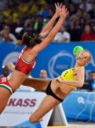 (191017) -- DOHA, Oct. 17, 2019 (Xinhua) -- Kristensen Line Gyldenlove (R) of Denmark vies with Speth Evelin of Hungary during the women s Beach Handball final between Hungary and Denmark at the 1st ANOC World Beach Games Qatar 2019 in Doha, capital of Qatar, on Oct. 16, 2019. (Photo by Nikku Xinhua) (SP)QATAR-DOHA-WORLD BEACH GAMES-BEACH HANDBALL 