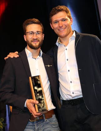 DSV clothing with award of the Golden Ski Markus Eisenbichler is ski athlete of the year, chosen by the active members of the German Ski Association The prize is presented by last years winner Thomas Dressen Laupheim Germany Kässbohrer Headquarters