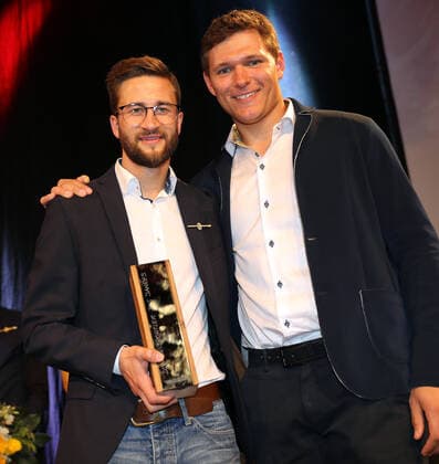 DSV clothing with award of the Golden Ski Markus Eisenbichler is ski athlete of the year, chosen by the active members of the German Ski Association The prize is presented by last years winner Thomas Dressen Laupheim Germany Kässbohrer Headquarters