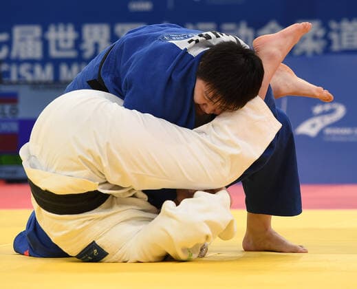 (191020) -- WUHAN,Oct. 20, 2019 -- Wang Yan (up) of China competes with Anamari Klementina Velensek of Slovenia during the women s +78kg judo final at the 7th International Military Sports Council (CISM) Military World Games in Wuhan, capital of central China s Hubei Province, Oct. 20, 2019. ) (SP)CHINA-WUHAN-7TH MILITARY WORLD GAMES-JUDO-WOMEN S +78KG FINAL(CN) LixHe 