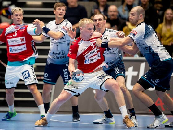 Aalborg Handbold meets SG Flensburg Handewitt in a Champions League mens handball match played in Jutlander Bank Arena, Aalborg, Sunday 20 October 2019 End 31 28 Magnus Saugstrup 14 Aalborg and Simon Hald Jensen 5, in the background Lasse Svan 11 and Janus Smaráson 3 Aalborg and Holger Glandorf 9, Aalborg,  Copyright: FotografxRenéxSchütze RenéxSchützex COP107 spdk20191020-193025-L