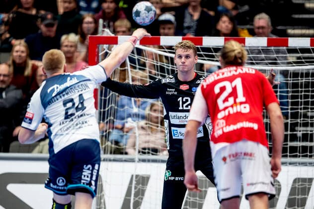 Aalborg Handbold meets SG Flensburg Handewitt in a Champions League mens handball match played in Jutlander Bank Arena, Aalborg, Sunday 20 October 2019 End 31 28 Big 2 half of Keeper Kristian Saeveraas 12 Aalborg here he catches penalty from Jim Gottfridsson 24, Aalborg,  Copyright: FotografxRenéxSchütze RenéxSchützex COP107 spdk20191020-193129-L