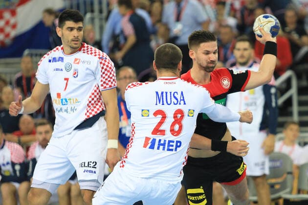 Zagreb, 23.10.2019. - Friendly handball match between Croatia and Germany at the Zagreb Arena. Croatia (white) - Germany (black) 25:26 Hendrik PEKELER (13) vs Zeljko MUSA (28) 