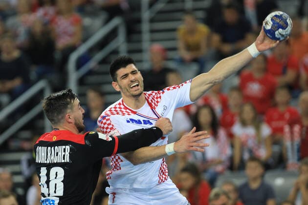 Zagreb, 23.10.2019. - Friendly handball match between Croatia and Germany at the Zagreb Arena. Croatia (white) - Germany (black) 25:26 Luka STEPANCIC (7) vs Jannik KOHLBACHER (48) 