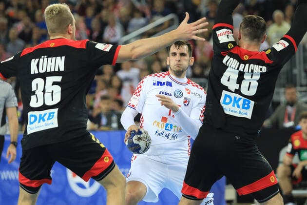 Zagreb, 23.10.2019. - Friendly handball match between Croatia and Germany at the Zagreb Arena. Croatia (white) - Germany (black) 25:26 Josip SARAC (17) vs Julius KUHN (35) and Jannik KOHLBACHER (48) 