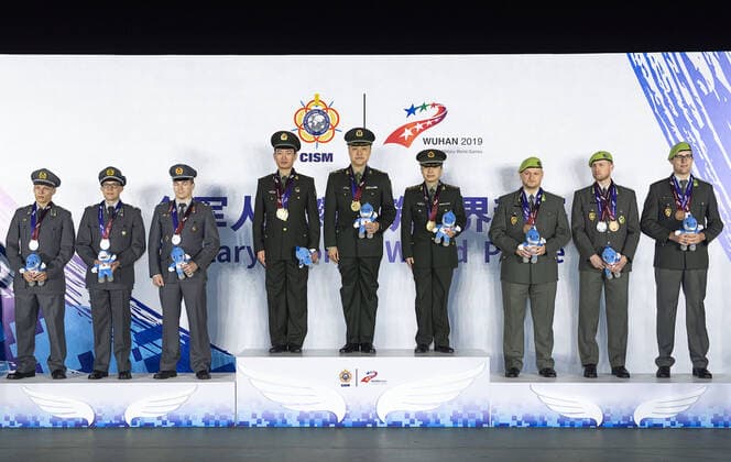 (191025) -- WUHAN, Oct. 25, 2019 -- Gold medalists team China(C), silver medalists team Finland (L) and bronze medalists team Austria attend the awarding ceremony of the team competition of 300m military rapid fire rifle of shooting at the 7th CISM Military World Games in Wuhan, capital of central China s Hubei Province, Oct. 25, 2019. ) (SP)CHINA-WUHAN-7TH MILITARY WORLD GAMES-SHOOTING XiongxQi 