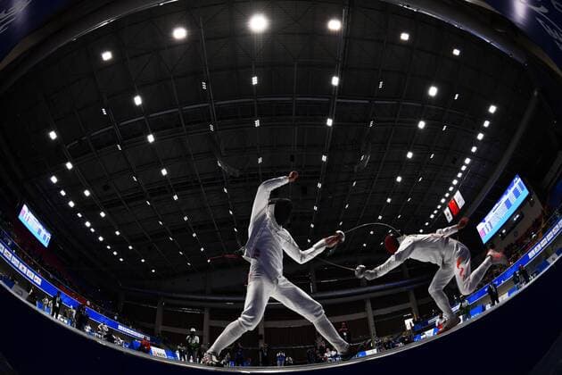 (191026) -- WUHAN, Oct. 26, 2019 -- Zhang Linbin (R) of China competes during the fencing of the mixed relay of Modern pentathlon, moderner Fünfkampf at the 7th CISM Military World Games in Wuhan, capital of central China s Hubei Province, Oct. 26, 2019. ) (SP)CHINA-WUHAN-7TH MILITARY WORLD GAMES-MODERN PENTATHLON LixGa 