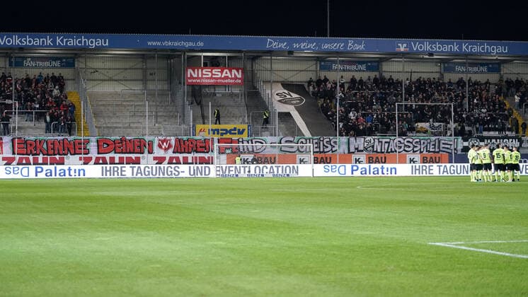The fans of both clubs protest against football matches on Monday with the banner Recognize your real enemy Shit Monday games, protest, joint fan protest, fans, audience, spectators, mood, atmosphere, stadium, symbol photo, symbolic picture, symbol, 28 10 2019, Sandhausen Germany , football, 2 Bundesliga, SV Sandhausen SV Wehen Wiesbaden, DFB DFL REGULATIONS PROHIBIT ANY USE OF PHOTOGRAPHS AS IMAGE SEQUENCES AND OR QUASI VIDEO xozx