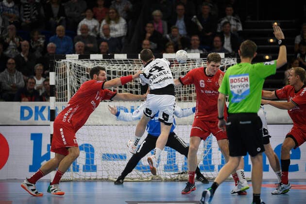 Miha Zarabec THW Kiel between Felix Danner Melsungen and Finn Lemke Melsungen , Handball Bundesliga, Liqui Moly HBL, Men, 11 Matchday, THW Kiel vs Melsungen, 31 10 19 Kiel Sparkassen Arena Schleswig Holstein Germany