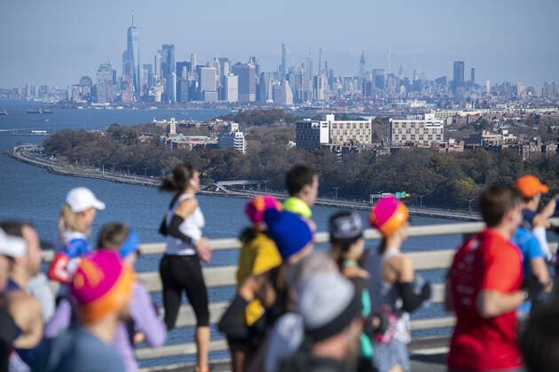 With Manhattan in the background, runners cross the Verrazano Bridge at the NYRR TCS New York City Marathon in New York City on Sunday, November 3, 2019. Over 50,000 runners from New York City and around the world will race through the five boroughs on a course that winds its way from the Verrazano Bridge before crossing the finish line by Tavern on the Green in Central Park.  NYP20191102513 COREYxSIPKIN
