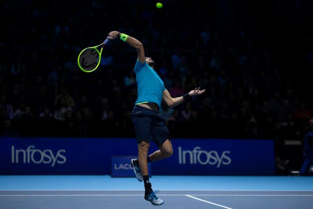10th November 2019; 02 Arena. London, England; Nitto ATP, Tennis Herren Tennis Finals; Matteo Berrettini (Italy) performs a smash return to Novak Djokovic (Serbia) - Editorial Use  ActionPlus12186536 ShaunxBrooks
