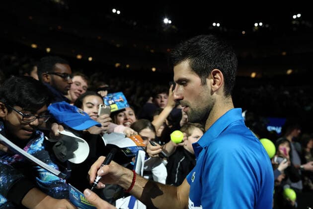 10th November 2019; 02 Arena. London, England; Nitto ATP, Tennis Herren Tennis Finals; Novak Djokovic (Serbia) signs autographs for fans after his 2 sets win against Matteo Berrettini (Italy) - Editorial Use  ActionPlus12186666 ShaunxBrooks