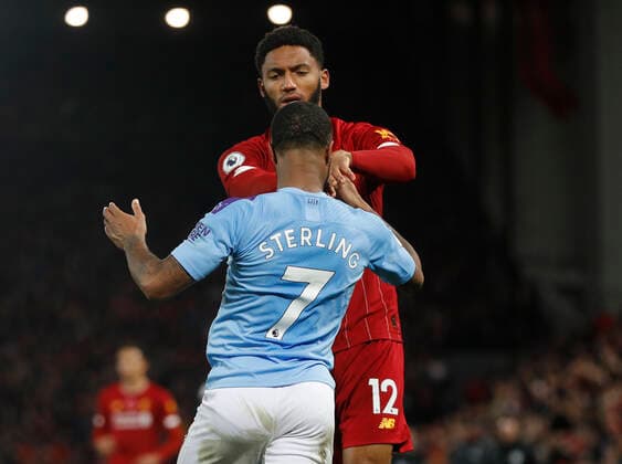Joe Gomez of Liverpool pushes Raheem Sterling of Manchester City during the Premier League match at Anfield, Liverpool. Picture date: 10th November 2019. Picture credit should read: Darren Staples Sportimage EDITORIAL USE ONLY. No use with unauthorised audio, video, data, fixture lists, club league logos or live services. Online in-match use limited to 120 images, no video emulation. No use in betting, games or single club league player publications. SPI-0311-0082