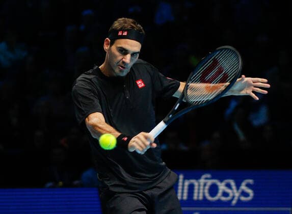 10th November 2019; O2 Arena, London, England; Nitto ATP, Tennis Herren Tennis Finals; Roger Federer (SUI) plays a backhand shot in his match against Dominic Thiem (AUT) - Editorial Use  ActionPlus12186954 HongboxChen