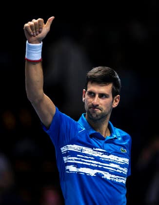 (191111) -- LONDON, Nov. 11, 2019 -- Novak Djokovic of Serbia celebrates after winning the singles group match against Matteo Berrettini of Italy at the ATP, Tennis Herren World Tour Finals 2019 in London, Britain on Nov. 10, 2019. ) (SP)BRITAIN-LONDON-TENNIS-ATP FINALS-DAY 1 HanxYan 