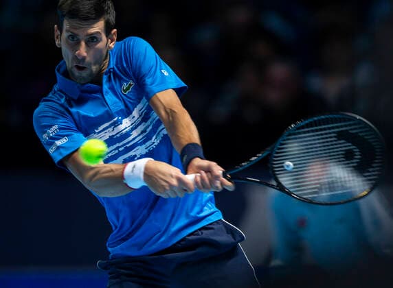(191111) -- LONDON, Nov. 11, 2019 -- Novak Djokovic of Serbia returns a shot during the singles group match against Matteo Berrettini of Italy at the ATP, Tennis Herren World Tour Finals 2019 in London, Britain on Nov. 10, 2019. ) (SP)BRITAIN-LONDON-TENNIS-ATP FINALS-DAY 1 HanxYan 