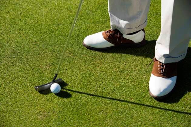 Person Putting Golf Ball 03B77487