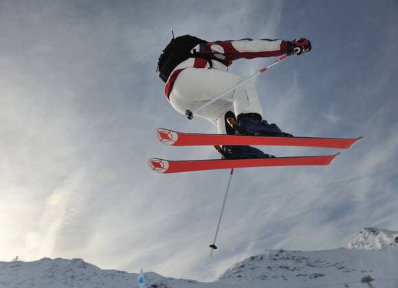 extreme freestyle ski jump with young man at mountain in snow park at winter season ING_32193_74464