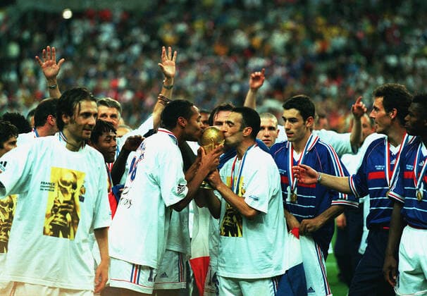 Djorkaeff & Henry Kiss Trophy Brazil V France 12 July 1998  Copyright: MaryxEvansxAllstarxRichardxSellers 12129456 editorial use only