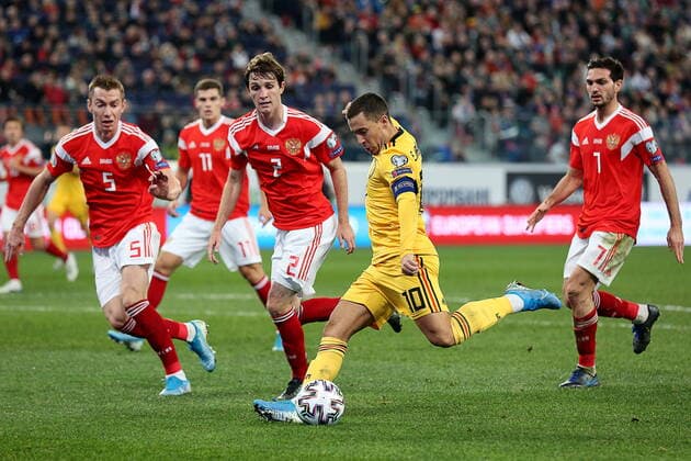 ST PETERSBURG, RUSSIA - NOVEMBER 16, 2019: Andrei Semyonov, Mario Fernandes (L-R), Magomed Ozdoyev (R) and Belgium s Eden Hazard (2nd R) in the 2020 UEFA European Championship, EM, Europameisterschaft Qualifying Round Group I football match between Russia and Belgium at Gazprom Arena. Peter Kovalev TASS  TS0C3761
