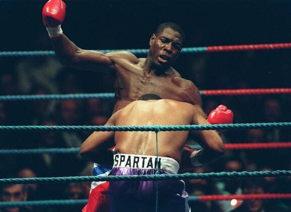 Großbritannien, Black History Month im Oktober - Sport Frank Bruno Wages War On Jesse Ferguson (Nec March 94) 30 March 1994  Copyright: MaryxEvansxAllstarxTonyxEdenden 12415493