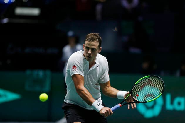 Vasek Pospisil of Canada plays a backhand against John Millman of Australia during Day 4 of the 2019 Davis Cup at La Caja Magica on November 21, 2019 in Madrid, Spain.  (20191121838)