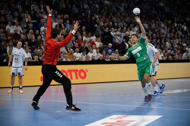 Lucas Krzikalla SC DHfK Leipzig, 8 against Niklas Landin Jacobsen THW Kiel, 1 , Handball Bundesliga, Liqui Moly HBL, Men, 14 Matchday, THW Kiel vs. SC DHfK Leipzig, 24 11 19 Kiel Sparkassen Arena Schleswig Holstein Germany