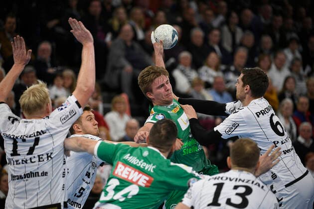 Franz Semper SC DHfK Leipzig, 3 against Hendrik Pekeler THW Kiel, 61 , Handball Bundesliga, Liqui Moly HBL, Men, 14 Matchday, THW Kiel vs. SC DHfK Leipzig, 24 11 19 Kiel Sparkassen Arena Schleswig Holstein Germany