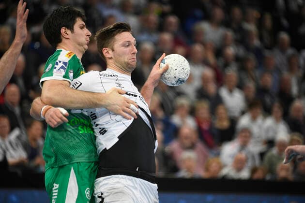 Harald Reinkind THW Kiel, 6 against Marko Mamic SC DHfK Leipzig, 22 , Handball Bundesliga, Liqui Moly HBL, Men, 14 Matchday, THW Kiel vs SC DHfK Leipzig, 24 11 19 Kiel Sparkassen Arena Schleswig Holstein Germany