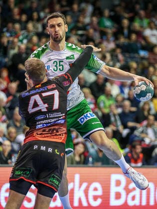 24 11 2019, Berlin, Handball, EHF Cup, 3 Round, 6 Matchday, Return match, Max Schmeling Halle, Foxes Berlin vs. HK Malmö Berlins Marko Kopljar r fights against Filip Berentsen of HK Malmö Foxes Berlin HK Malmö