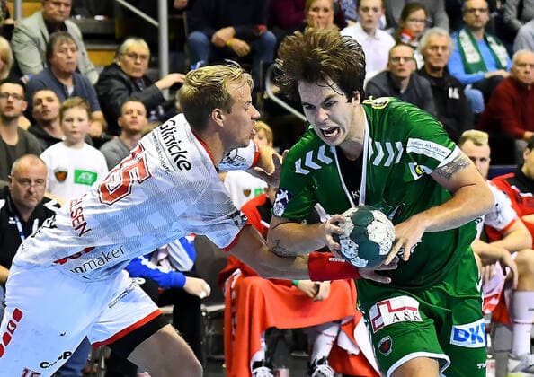 28 11 2019, xlakx, Handball Bundesliga, Fuechse Berlin MT Melsungen emspor, v l Duel Lasse Mikkelsen MT Melsungen 15 ,Jacob Tandrup Holm Fuechse Berlin 6 Berlin