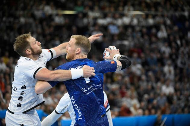 Steffen Weinhold THW Kiel, 13 against Jonas Truchanovicius Montpellier HB, 7 , Handball, Men, THW Kiel vs. Montpellier HB, Champions League, 9 Matchday, Group Phase, 30 11 19 Kiel Sparkassen Arena Schleswig Holstein Germany