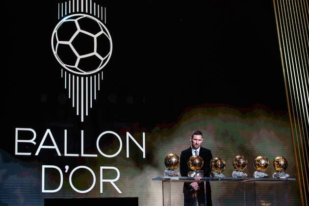 (191203) -- PARIS, Dec. 3, 2019 (Xinhua) -- Barcelona s Argentinian forward Lionel Messi poses with the trophies during the Ballon d Or 2019 awards ceremony at the Theatre du Chatelet in Paris, France, Dec. 2, 2019. (Photo by Aurelien Morissard Xinhua) (SP)FRANCE-PARIS-SOCCER-BALLON D OR 2019 AWARDS 