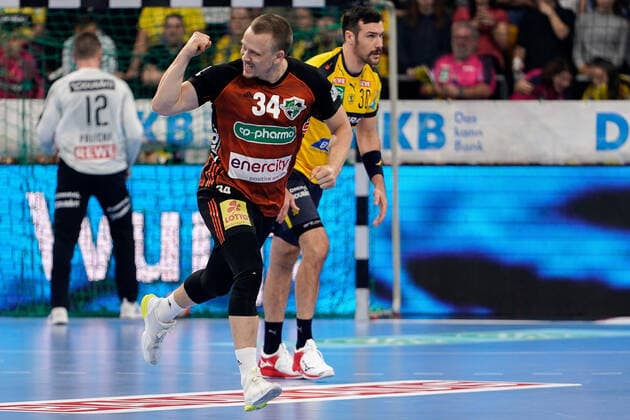 v li goalscorer Morten Olsen Hannover, 34 , Gedeon Guardiola RNL, 30 , cheers about a goal, cheers, goal jubilation, goal success, celebrate the goal, goal, celebration, cheers about the goal, optimistic, game scene, highlight, single picture, action, action, 04 12 2019, Mannheim Germany , handball, DHB trophy, Rhein Neckar Löwen TSV Hannover Burgdorf xozx