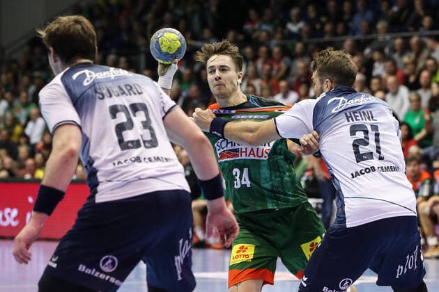 Michael Damgaard SC Magdeburg against Jacob Heinl re and Goran Sogard Johannessen SG Flensburg Handewitt Handball Bundesliga Season 2019 2020 SC Magdeburg vs SG Flensburg Handewitt in the GETEC Arena in Magdeburg Action,Handball,MannMänner,Germany,05 12 2019