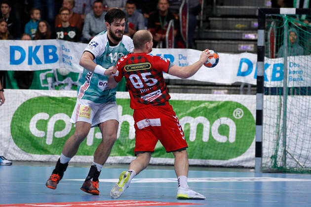 08 12 2019, TUI Arena, Hannover, league game, 1 Bundesliga, TSV Hannover Burgdorf vs Fuechse Berlin, in picture Evgeni Pevnov 14, Han Burgdorf in duel with Paul Drux 95, Berlin TSV Hannover Burgdorf vs Fuechse Berlin